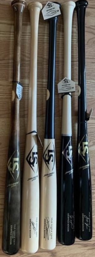 Louisville Slugger Prime Maple bat, 33 inch, leaning against a wood floor